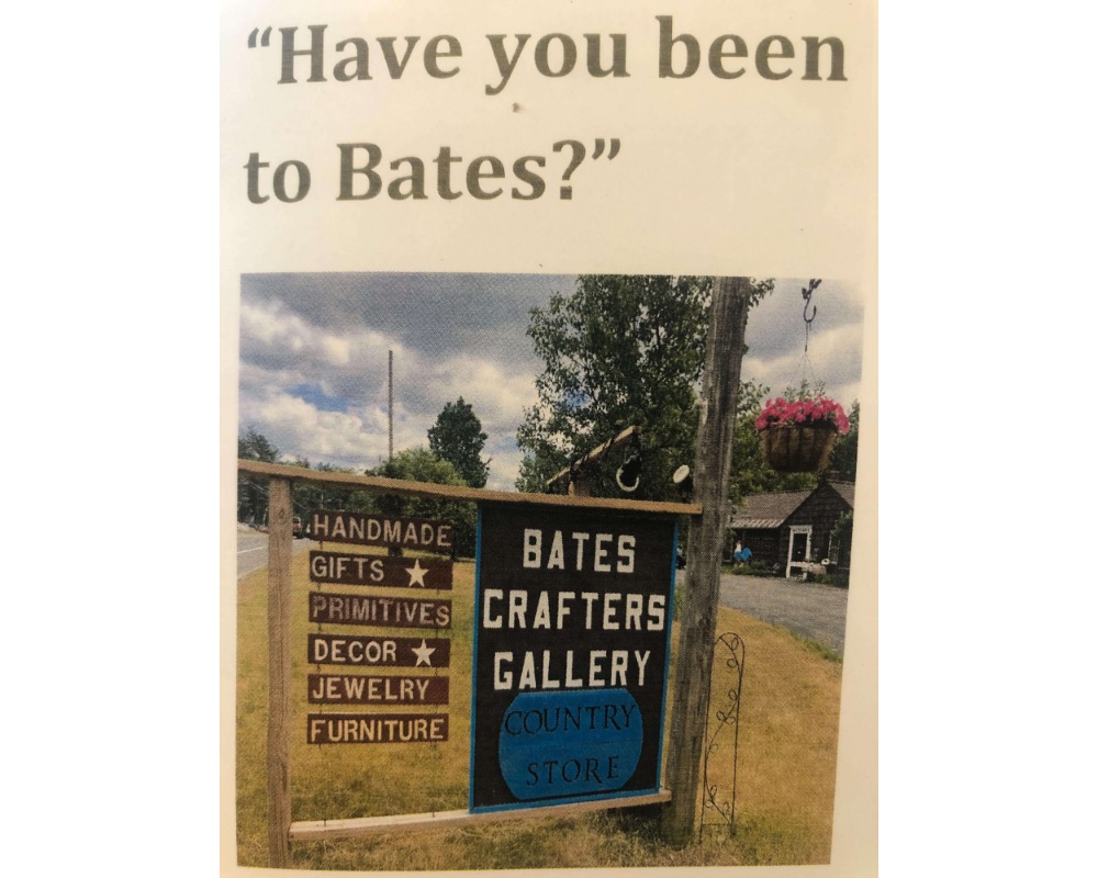 A photo of the roadside sign for the Bates Crafter Gallery. It also says handmade gifts, primitives, decor, jewelry and furniture